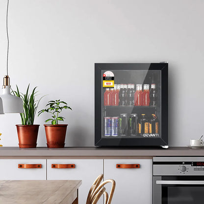 Modern kitchen with a Devanti wine cooler on a countertop, surrounded by potted plants and kitchen appliances.